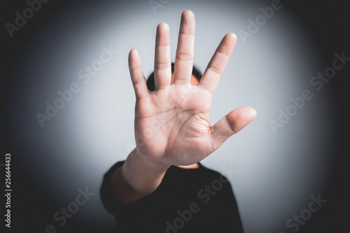 Hand of young man implying NO sign, rejecting expression or prevention