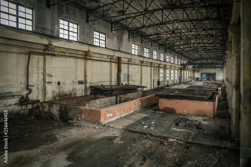 Abandoned industrial building interior. Former reinforced concrete factory