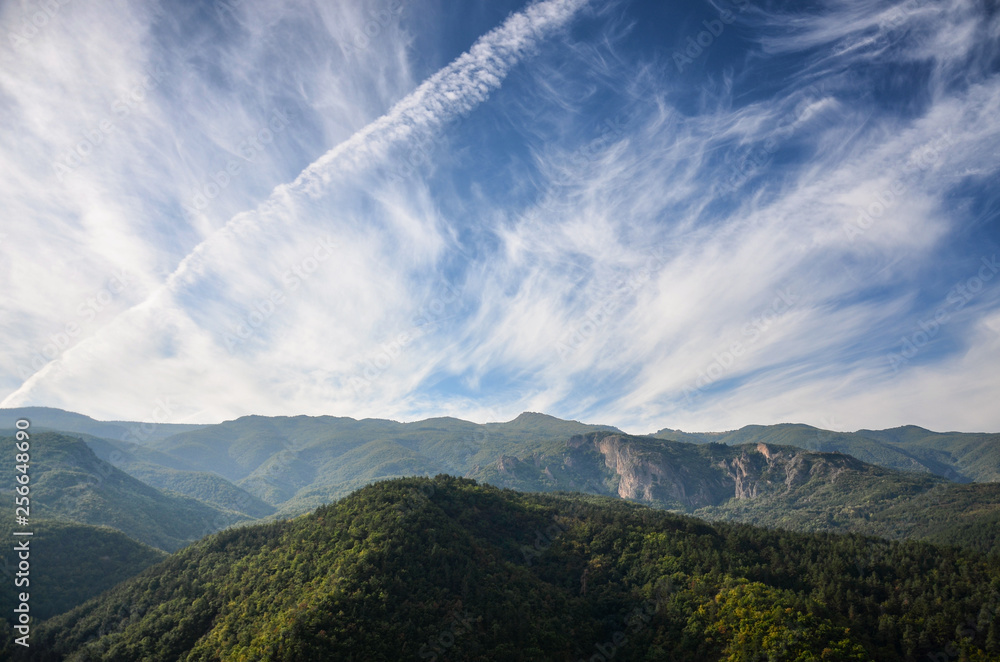Obraz premium Spring time panoramic landscape from Rhodope mountain, Bulgaria. Blue sky with white clouds