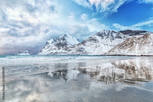 Captivating arctic scenery of Haukland beach in Norway on Lofoten islands - iconic travel destination of nature lovers. Majestic scene on northern arctic beach on March. Norwegian sea coastline. © Feel good studio