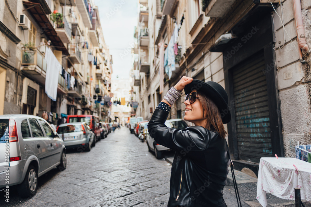 Traveler girl walking by the streets of Naples Traveler girl walking by the streets of Naples