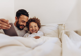 Father and son having fun at home