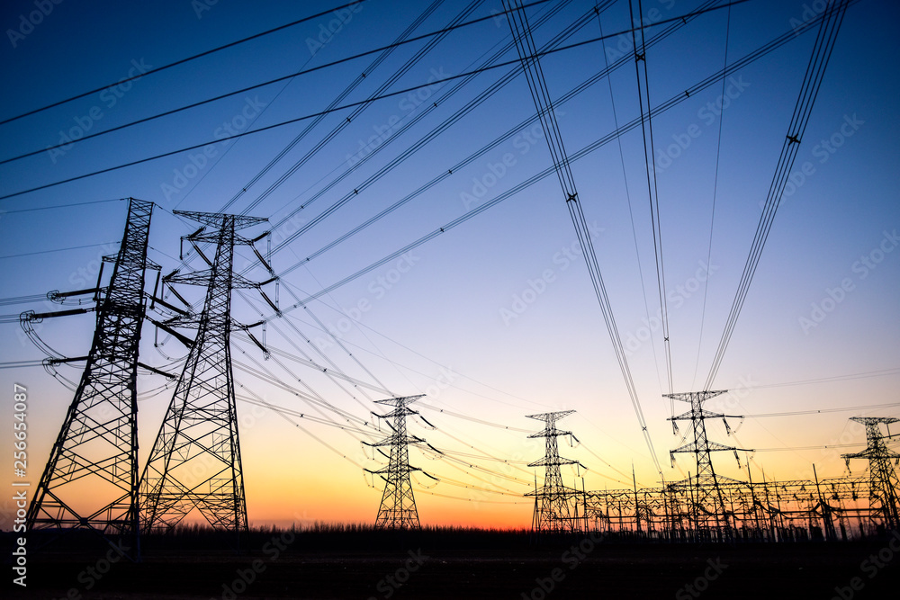 Fototapeta premium In the evening, the outline of the transmission tower
