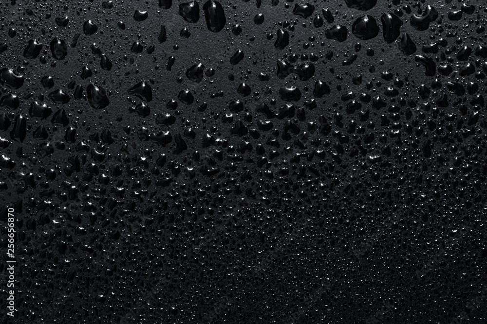 Black surface with clear water drops, background Black surface with clear water drops, background