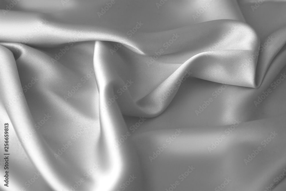 Fototapeta premium Rippled white silk fabric satin cloth waves background