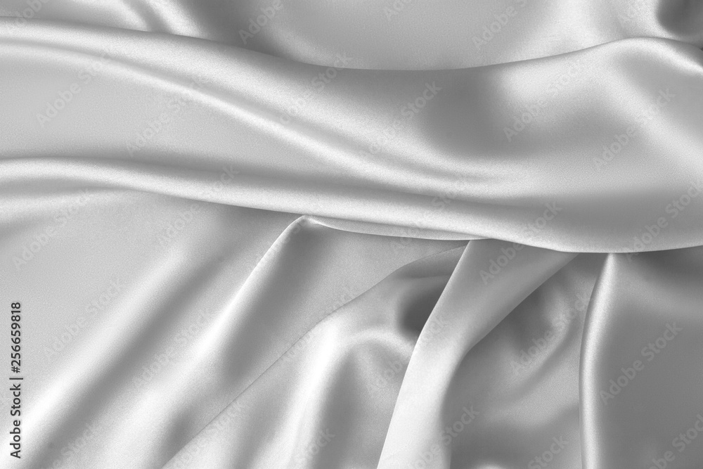 Fototapeta premium Rippled white silk fabric satin cloth waves background