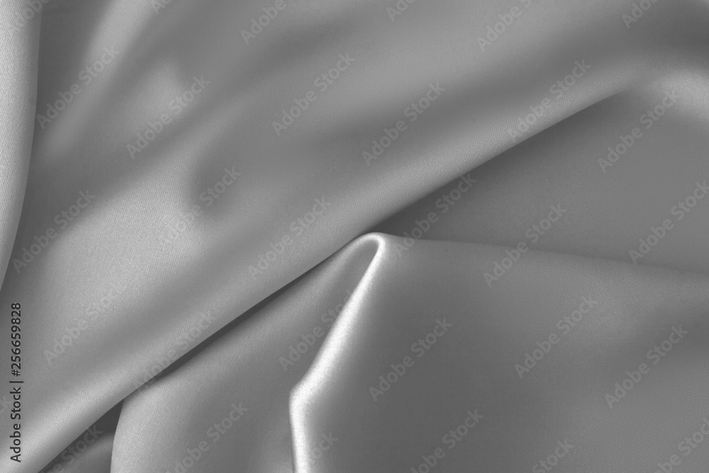 Obraz premium Rippled white silk fabric satin cloth waves background