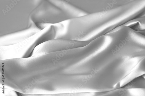 Fototapeta Naklejka Na Ścianę i Meble -  Rippled white silk fabric satin cloth waves background