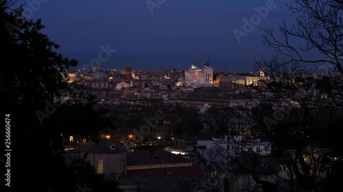 Zoom out effect night view, Rome historical center, roofs and monuments