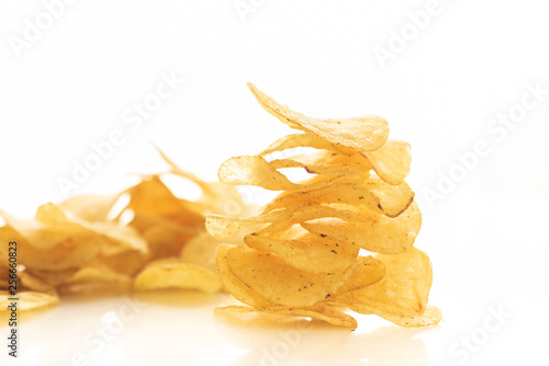 potato chips scattered on white background isolate