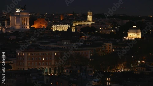Rome aerial night view of historical center illuminated, Domes, roofs and monument. Synagogue, Capitol, tower, venice square.