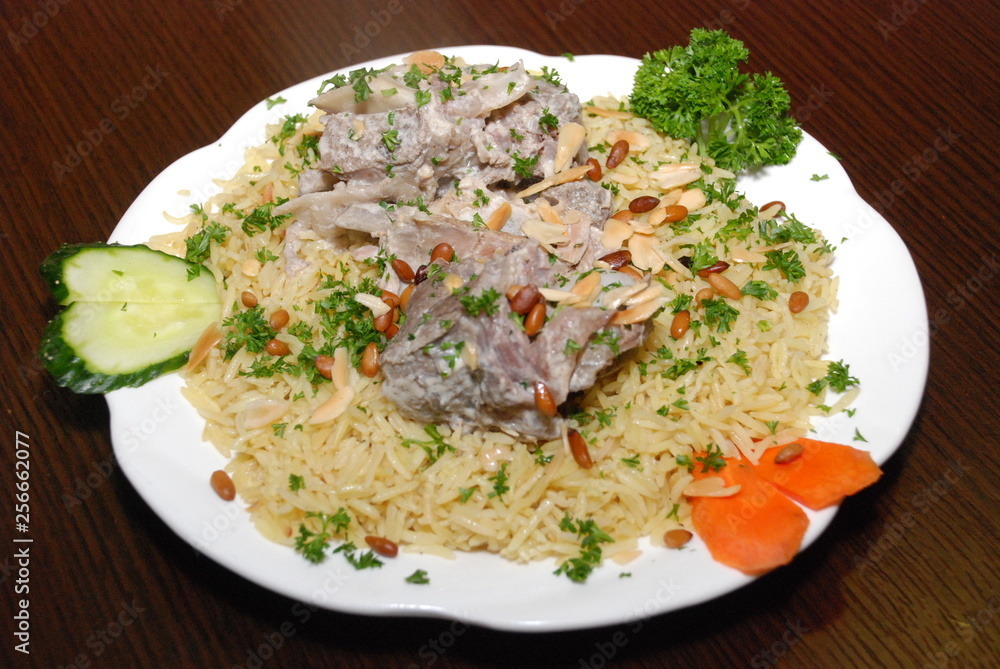 rice with vegetables and meat, seasoned with pine nuts and spices rice with vegetables and meat, seasoned with pine nuts and spices