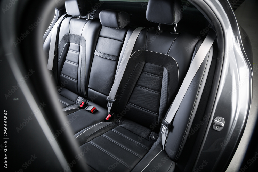 Close up of black leather passenger seats Close up of black leather passenger seats