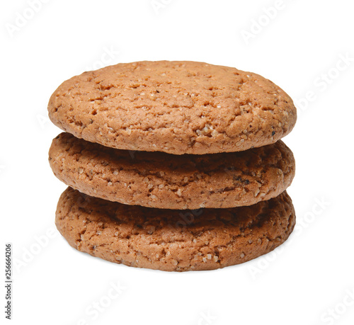 Several pieces of oatmeal cookies are hilted on top of each other. White isolated background. Close quarters. Side view.