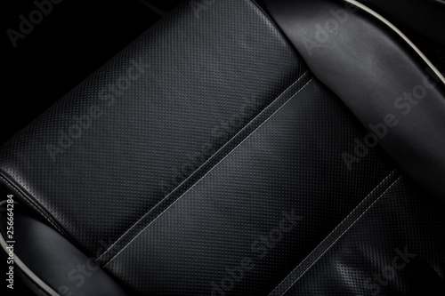 Close up of black leather car seat