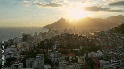 Aerial view of famous favela Pavao-Pavaozinho and Ipanema Beach (Playa)/Leblon Beach during sunset in city of Rio de Janeiro - landscape panorama of Brazil from above, South America photo