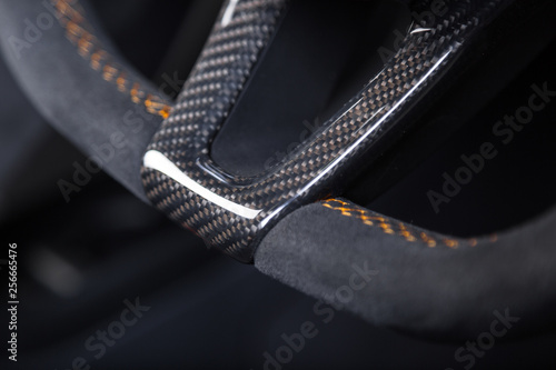 Close up of carbon fibre car steering wheel photo