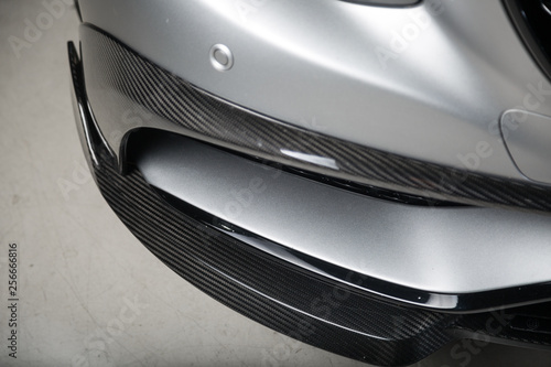 Carbon fibre body kit on silver sports car