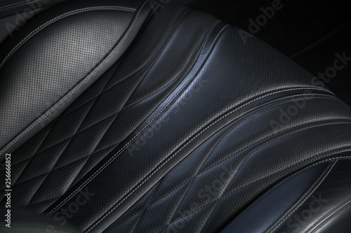 Detail shot of black leather car seat