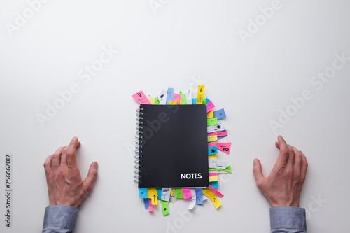 Note pad full of post it notes from above