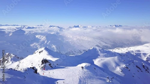 Aerial footage skiing above the mountain with stunning perspective photo