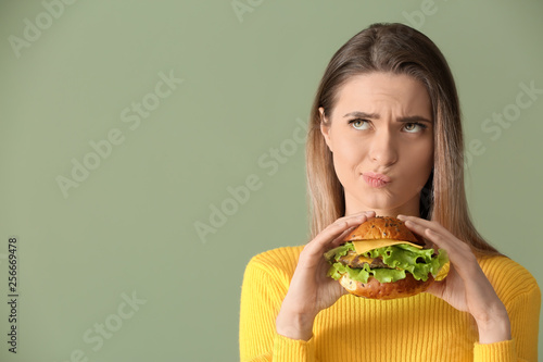 Thoughtful young woman with...