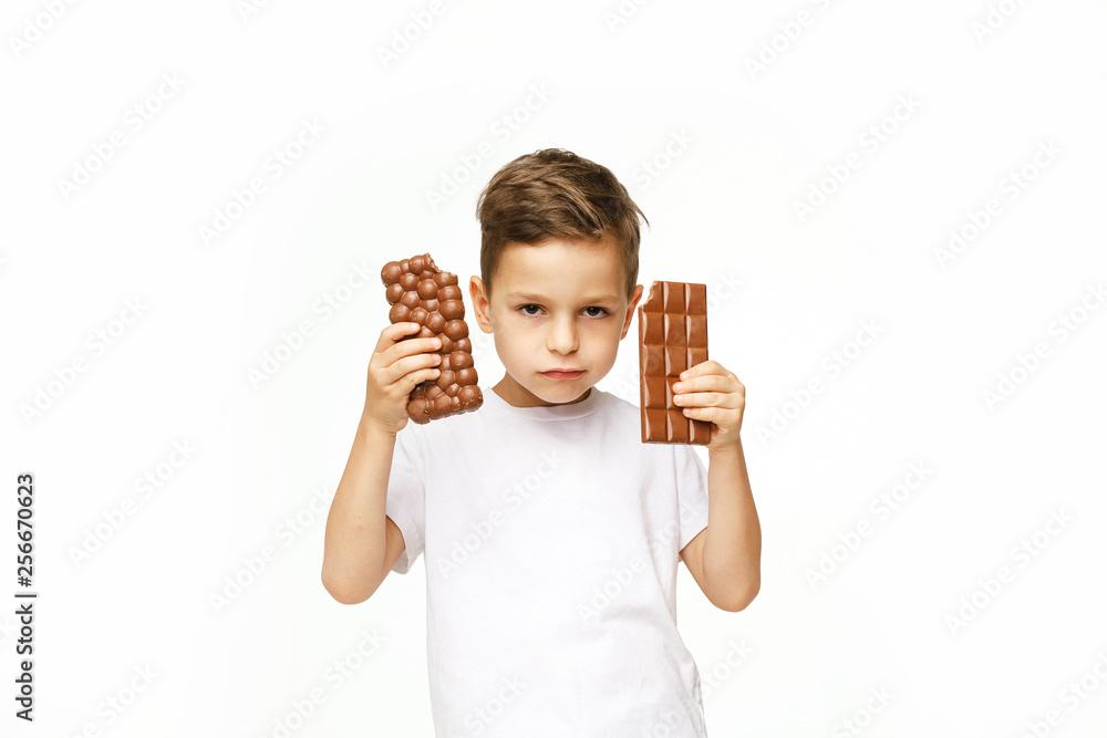 little beautiful boy holding chocolates studio shot little beautiful boy holding chocolates studio shot