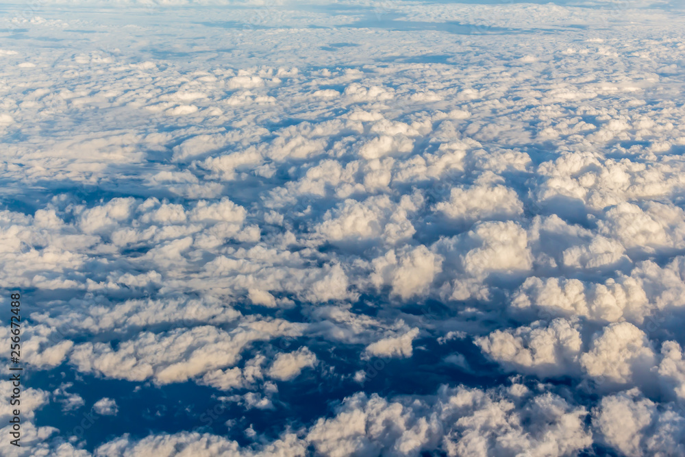 Naklejka premium Clouds sky looking from the plane