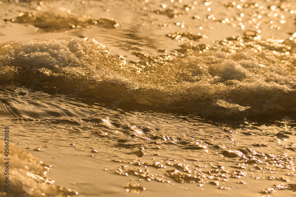 Streams of water from melting snow at the evening sun autumn background. Streams of water from melting snow at the evening sun autumn background.