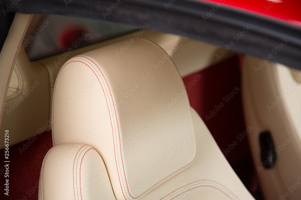 Cream leather headrest of car seat