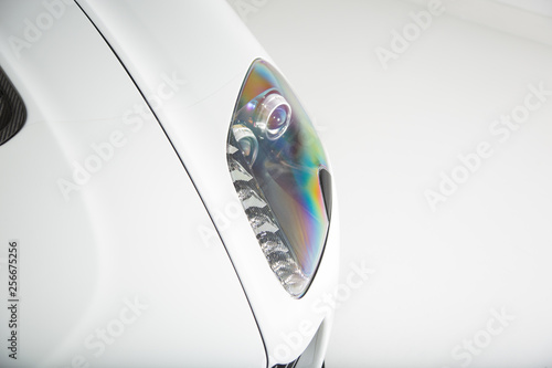 Close up of white car headlight