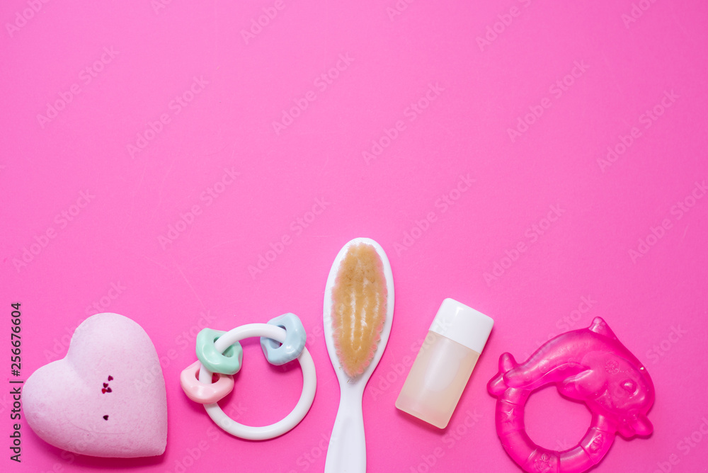 Flat lay composition with baby accessories and space for text on pink background. spa consept