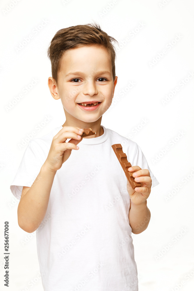 little beautiful boy holding chocolates studio shot little beautiful boy holding chocolates studio shot
