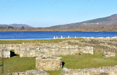 Roman ruins with lake. Aquis Querquennis archaeological site. Baños de Bande, Orense, Spain. photo