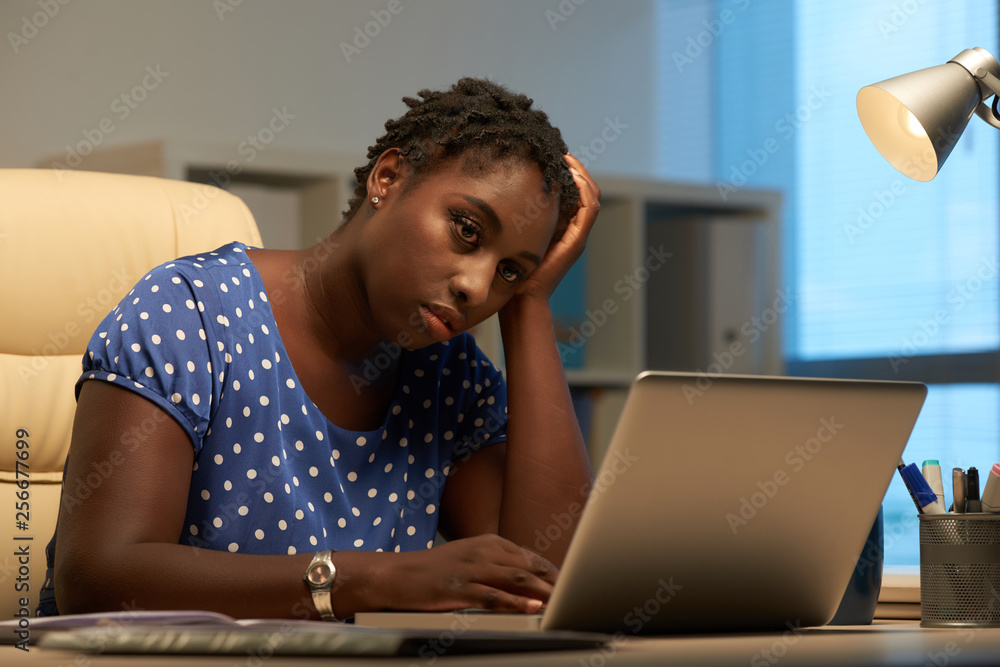 Pensive entrepreneur reading e-mail Pensive entrepreneur reading e-mail