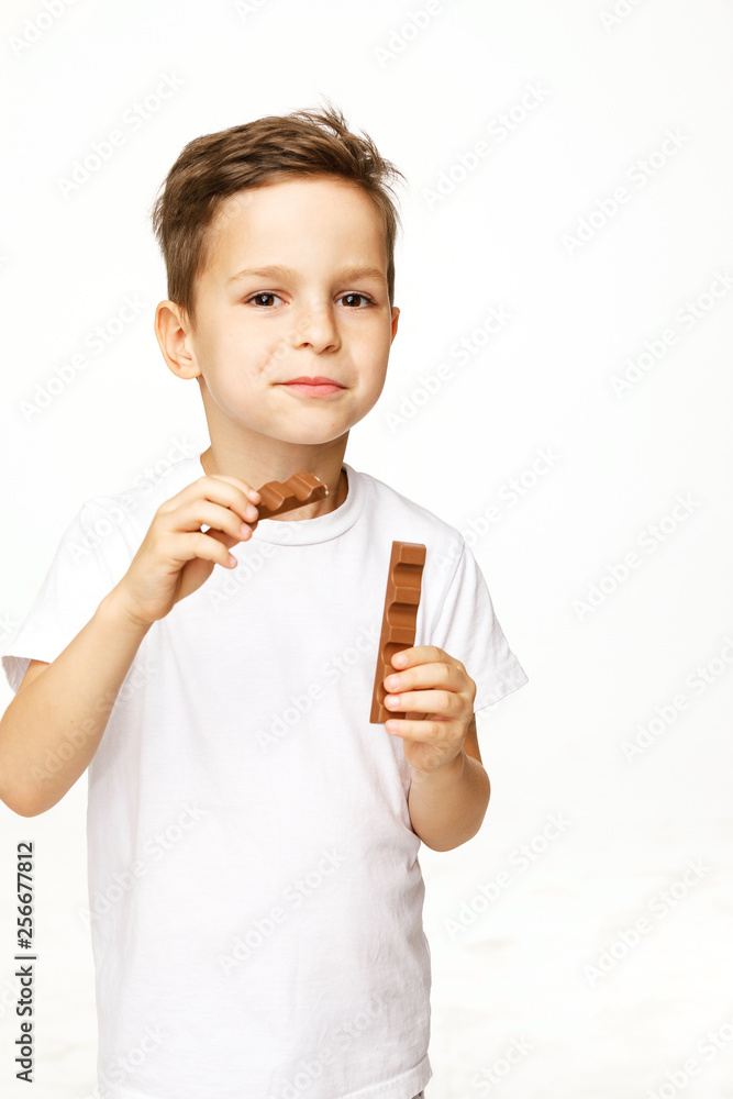 little beautiful boy holding chocolates studio shot little beautiful boy holding chocolates studio shot