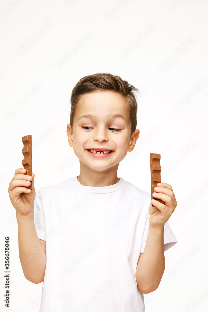 little beautiful boy holding chocolates studio shot little beautiful boy holding chocolates studio shot