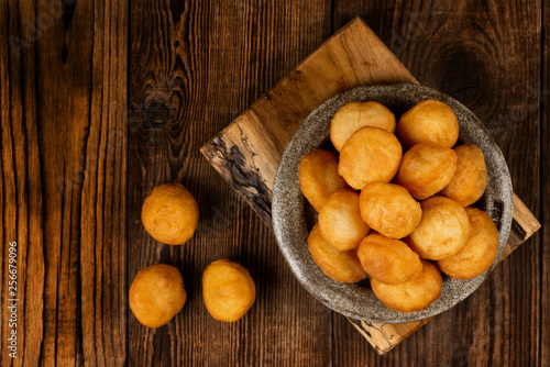 Baursak - traditional Kazakh (Asia) food \ national bread in plate on wooden background, top view