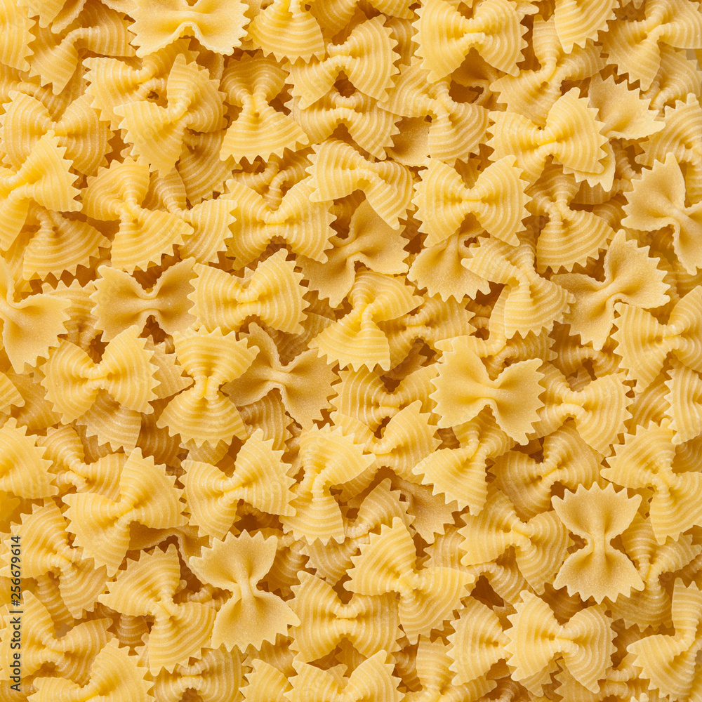 Dried bow tie pasta background Dried bow tie pasta background