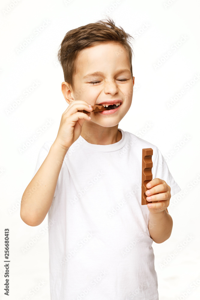 little beautiful boy holding chocolates studio shot little beautiful boy holding chocolates studio shot
