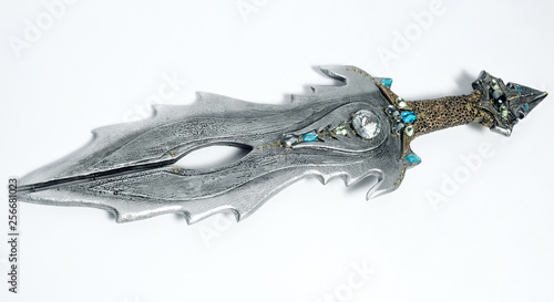 Closeup of vintage metal sword decorated with gems 