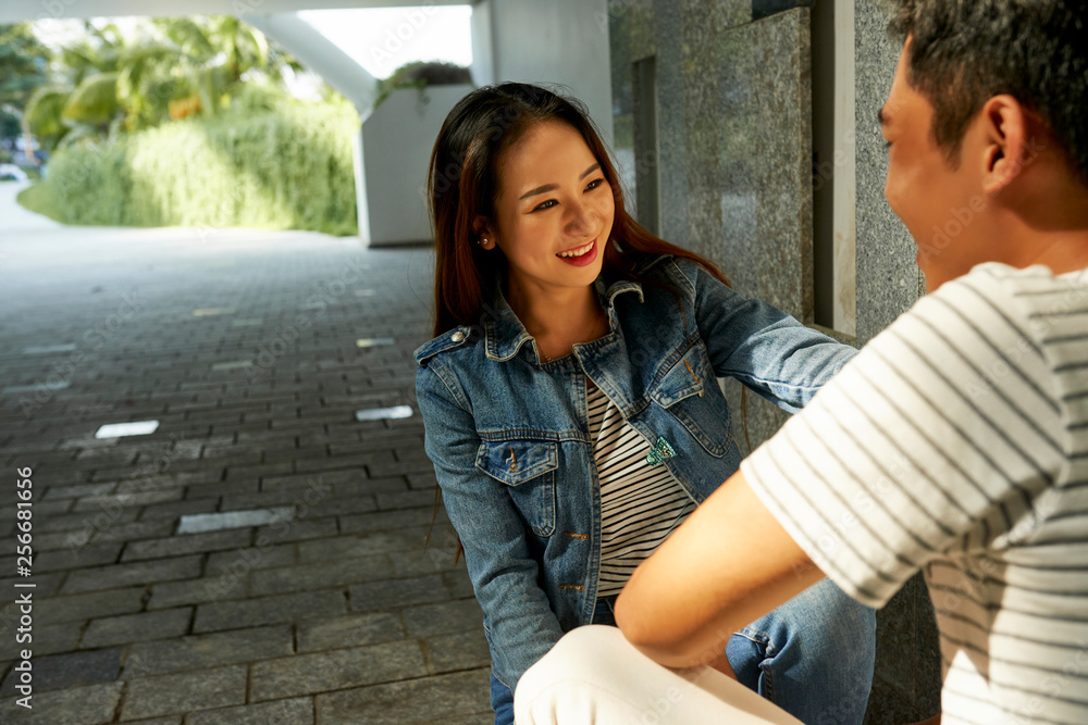 Smiling woman talking to friend Smiling woman talking to friend