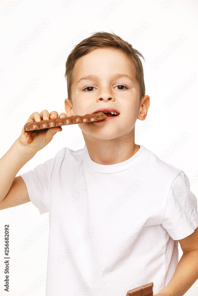 little beautiful boy eating chocolate studio shot little beautiful boy eating chocolate studio shot