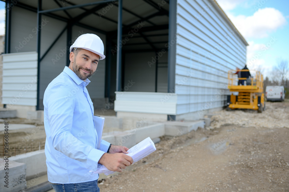 portrait of a handsome young man architect on a building industry construction site portrait of a handsome young man architect on a building industry construction site