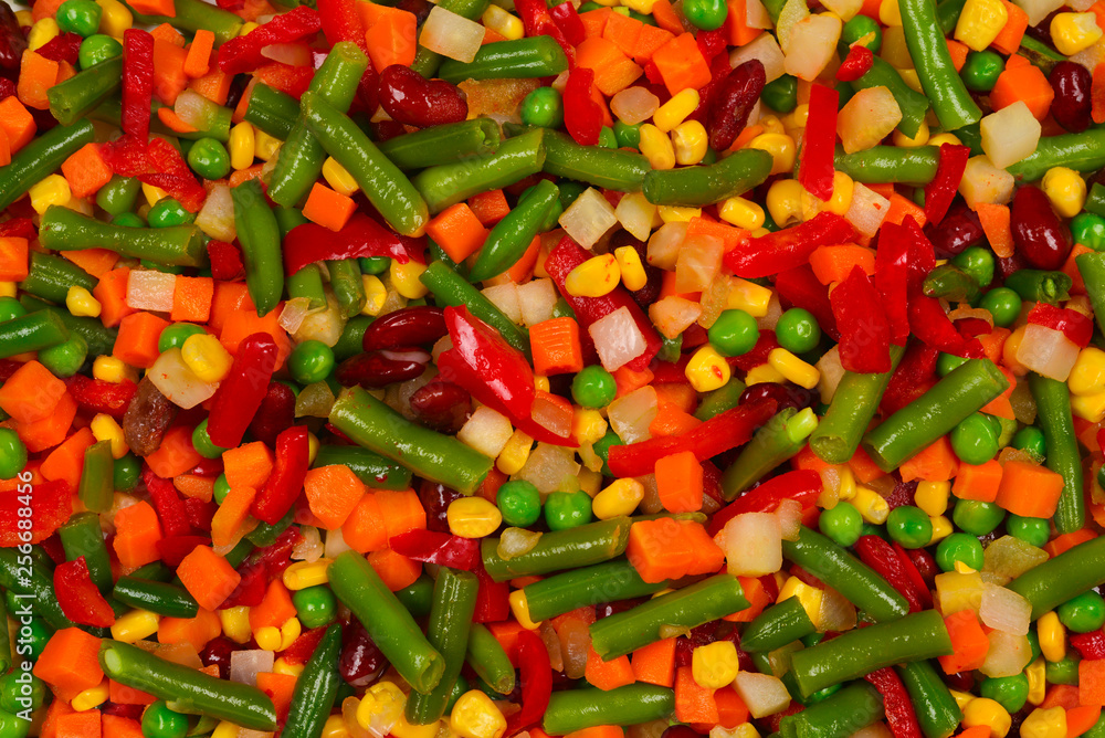 Sliced vegetables, corn, beans, peas, carrots, sweet peppers background. Sliced vegetables, corn, beans, peas, carrots, sweet peppers background.