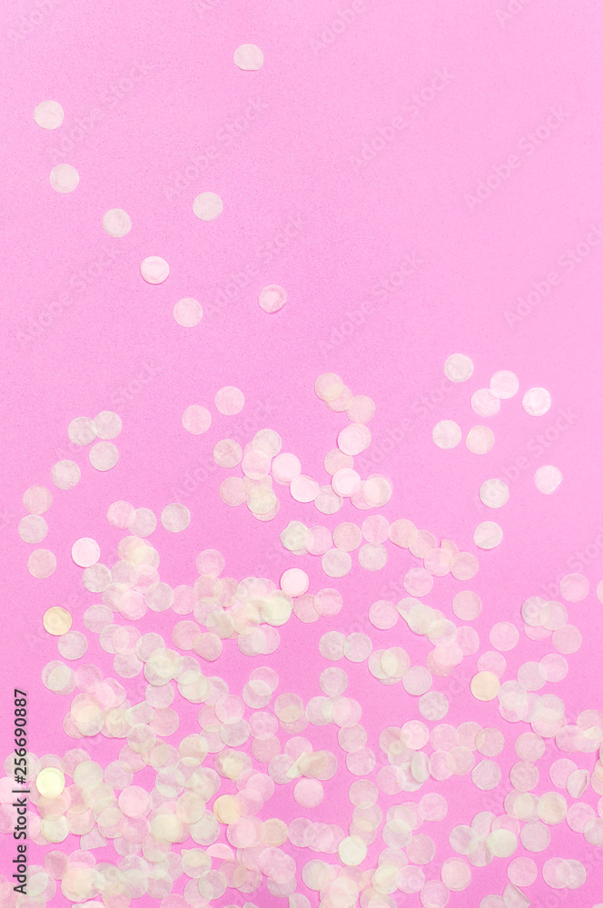 Flat lay paper round confetti on pastel pink background top view. Festive holiday background, concept of party, birthday, christmas or new year. Copyspace for text Flat lay paper round confetti on pastel pink background top view. Festive holiday background, concept of party, birthday, christmas or new year. Copyspace for text