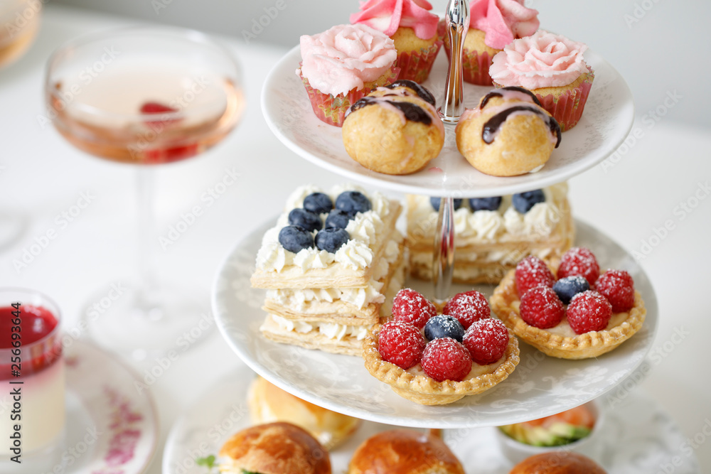 Afternoon tea with mini brioche canapes and selection of sweets Afternoon tea with mini brioche canapes and selection of sweets