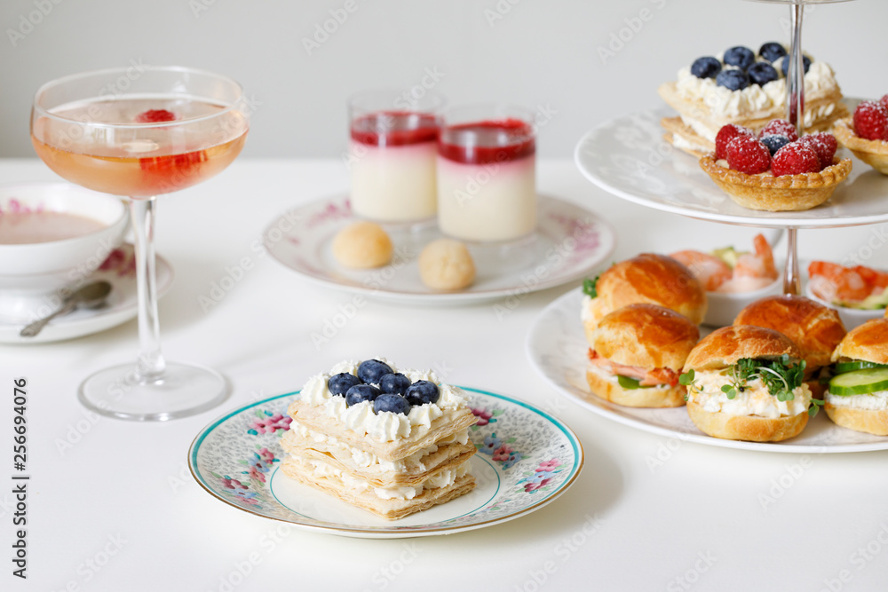 Afternoon tea with mini brioche canapes and selection of sweets Afternoon tea with mini brioche canapes and selection of sweets