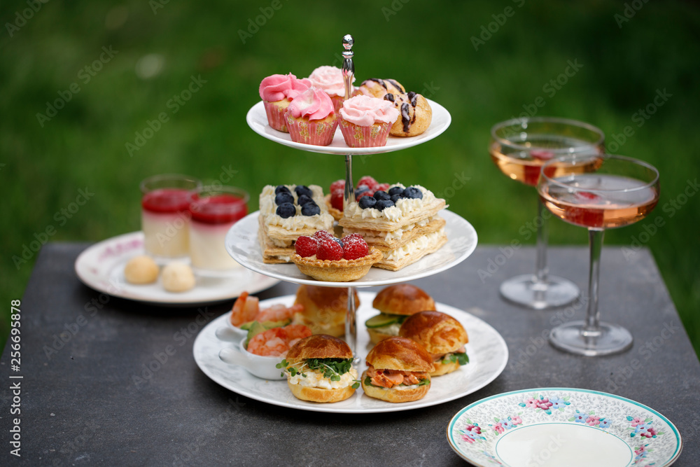Afternoon tea with mini brioche canapes and selection of sweets Afternoon tea with mini brioche canapes and selection of sweets