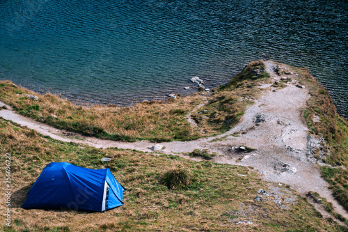 Mountain top. adventures Camping tourism and tent. landscape near water outdoor at Lacul Balea Lake, Transfagarasan, Romania. Concept Travel, copy space